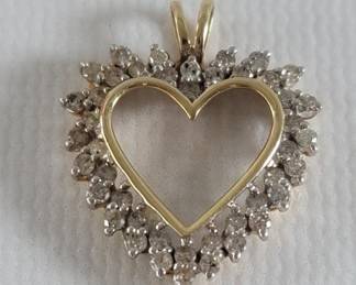022 Lot 611 14k gold and diamond heart shape pendant