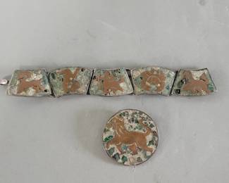 084 Lot 435 Sterling silver, brass and turquoise bracelet with matching brooch