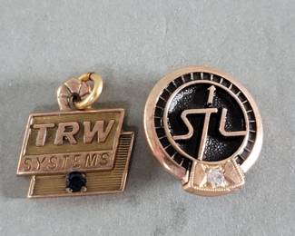 028 Lot 490 10k gold sapphire T.R.W. pendant and 10k gold diamondenamel S.T.L. Systems brooch