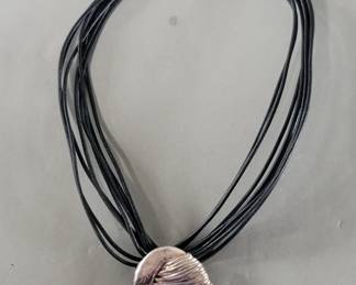 197 Lot 217 Sterling silver modernist pendant with multistrand leather cord necklace