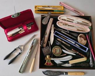 Antique assortment of dip pens, curling iron, button hooks, portrait pin, Carrie Nation glass painted hatchet