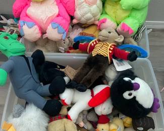 Two Bins Full Of A Mixture Of Stuffed Animals
