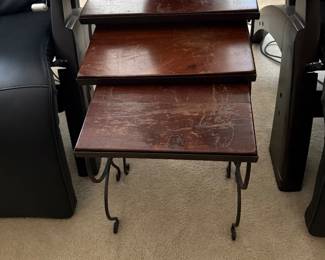 Nesting wooden tables with decorative metal legs