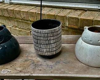 Black bear pot and white cat pot