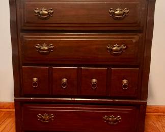 Vintage tall chest of drawers / highboy dresser with rich wood finish, traditional brass-tone drawer pulls, and distinctive lion-head ring pulls on the center drawers. Multiple drawers provide generous storage, with classic traditional styling throughout. Researched prior to sale.