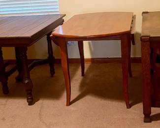 Preview of select dining and occasional tables available at the sale, including the Arts & Crafts / Mission-style tiger oak library table, vintage drop-leaf table, and Jacobean-style dining table shown without its three extension leaves. Additional furniture and estate pieces will also be available.