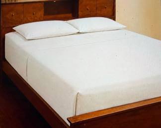 Vintage wood bed frame — headboard and footboard only. Headboard features built-in drawers and open center storage. Warm wood finish with a clean mid-century/traditional look. Mattress and bedding not included.