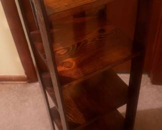 Vintage 4-foot open wood display stand with multiple shelves and tall vertical supports. Simple, attractive design with warm wood grain and plenty of space for books, plants, collectibles, or décor. Researched prior to sale.