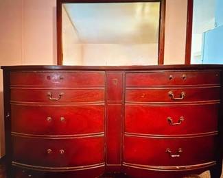 Vintage Dixie Furniture dresser with large coordinating mirror, curved-front drawers, decorative center detailing, and brass-tone hardware. Rich wood finish with classic traditional styling and generous storage. Researched prior to sale.