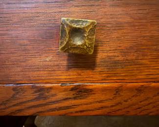 Close-up detail of original-style hardware and visible oak grain on the Arts & Crafts / Mission-style tiger oak library table.