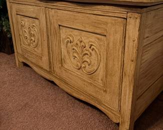 Vintage carved wood storage cabinet / console with two paneled front doors and raised floral/foliate carving. Warm distressed finish, substantial construction, and decorative traditional styling. Versatile for storage, entryway, dining room, or living room use. Researched prior to sale.