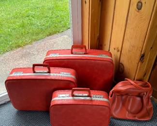 Garage: vintage orange luggage