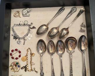 Dining Room: Sterling spoons, gold charm bracelet, gold filled brooches, white gold filled charm bracelet