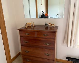 Bedroom 1: tall dresser, cat figurines
