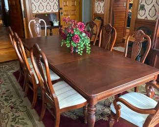Ethan Allen Dining table with two leaves and eight matching upholstered chairs