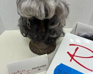 short, layered synthetic wig from the premium Raquel Welch Wig Collection.
