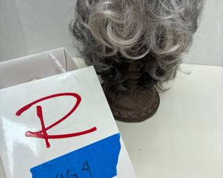 short, layered synthetic wig from the premium Raquel Welch Wig Collection.