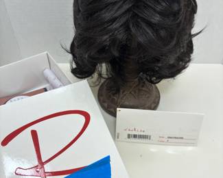 short, layered synthetic wig from the premium Raquel Welch Wig Collection.