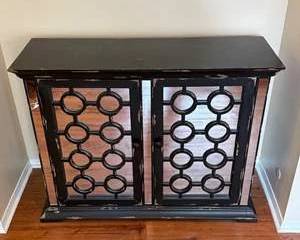 Wood Accent Cabinet with Black Metal Circle Design