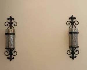Pair of Black Scrollwork Wall Sconces with Glass Candle Holders