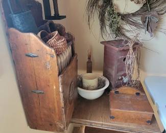 Vintage table. Slant box. Small cabinet. Baskets. Wreath.