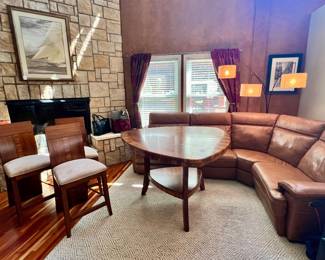 This unique heart shape table with matching wood on 3 chairs and credenza make a stunning statement! You'll find the credenza on the lower level.