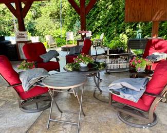 In the cabana… set of red chairs,  all with covers