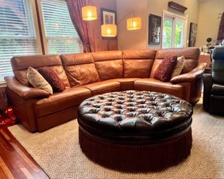 Four piece brown leather Natuzzi sectional with two reclining positions on ends