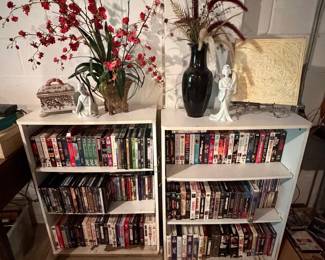 Collection of Assorted VHS Tapes and Decorative Shelving