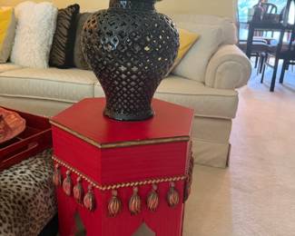 Black Reticulated Ginger Jar and Red Hexagonal Accent Table with Tassels