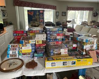 2 Tables full of puzzles