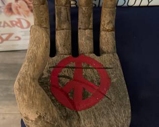Peace sign on wooden hand