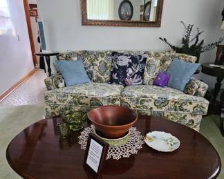 Two-seat couch in excellent condition, accompanied by Queen Anne style coffee table.