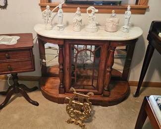 Vintage sewing cabinet, porcelain figurines, and small cabinet.