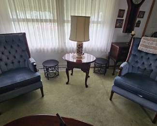 Beautiful blue chairs, with end table and plant stands.