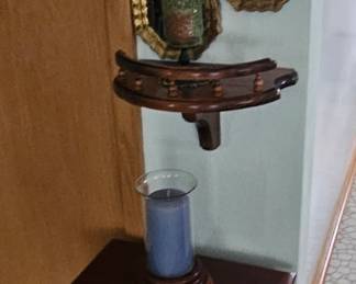 Queen Anne Style telephone table with home decor pieces.