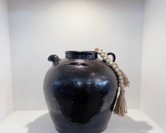 Rustic-style dark glazed ceramic storage jar