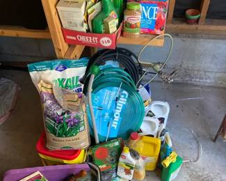 Gardeners Lot Of Chemicals Fertilizers With Soaker Hoses Bag Full Of Garden Tools