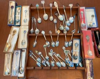 Collection Of Teaspoon Souvenirs With Spoon Display