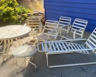 Two Glass Top Patio Tables with Metal Patio Chairs including Rockers and Lounger