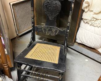 Caned press back early american rocking chair