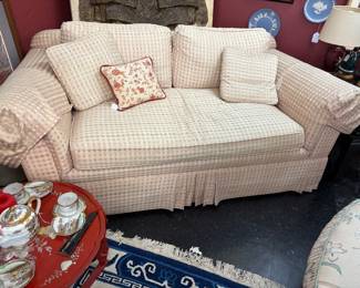 Charming overstuffed rolled arm loveseat.  Custom upholstery. Excellent condition