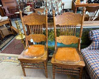 2 "mouse ear" embossed antique chairs with spindle backs and braces