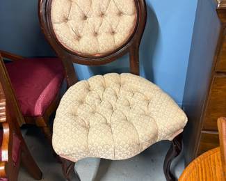 Victorian tufted rose carved chair with queen ann legs.  Needs to be tightened
