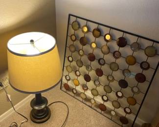 A Metal Table Lamp And A Wall Hanging Abstract Metal With Mirrors Piece