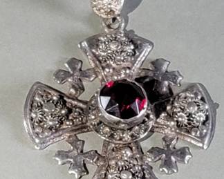 717 Lot 528 Silver Victorian style cross pendant with a red
