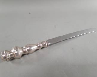 254 Lot 465 Sterling silver handle serrated knife