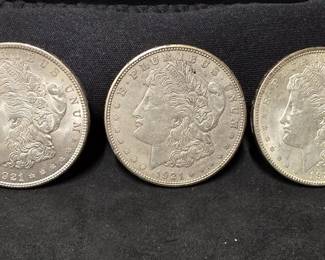 554 Lot 317 2 1921 and 1 1921D Morgan silver dollar coins