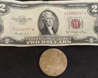 694 Lot 50 1923 Peace silver dollar coin and a 1953 Red