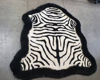106 Lot 608 Cowhide rug